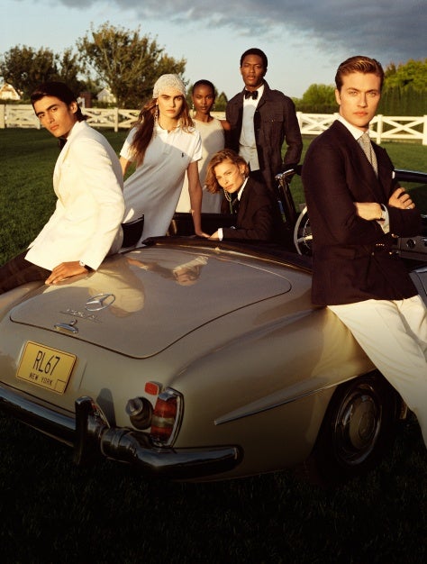 Models around Mercedes convertible wear black and white Ralph Lauren attire.