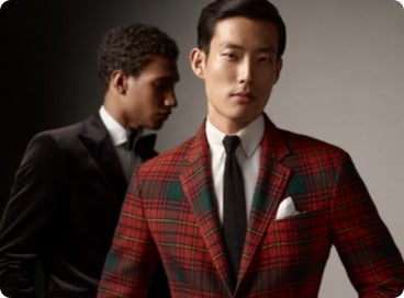 Men wear velvet and red plaid sport coats.