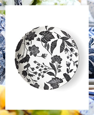 White plate with delicate black floral pattern