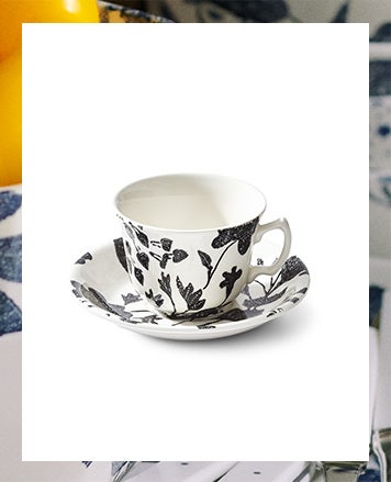 Cup & saucer with dense black & white floral pattern