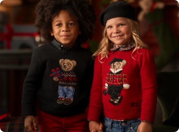 Kids wear sweaters with Polo Bears at front.