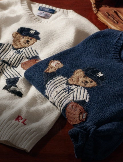 White and navy sweaters with the Yankees Polo Bear at front.