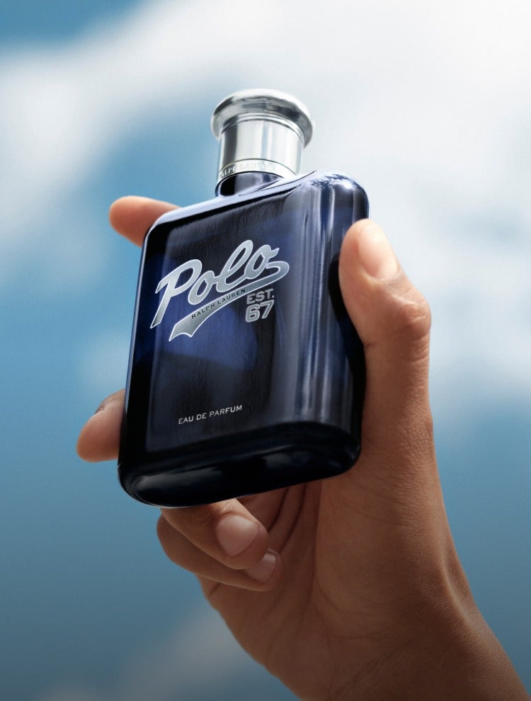 Navy fragrance bottle with silver cap.