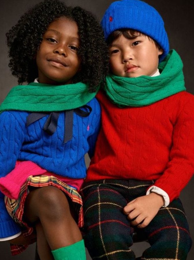 Kids wear blue and red cable-knit sweaters.