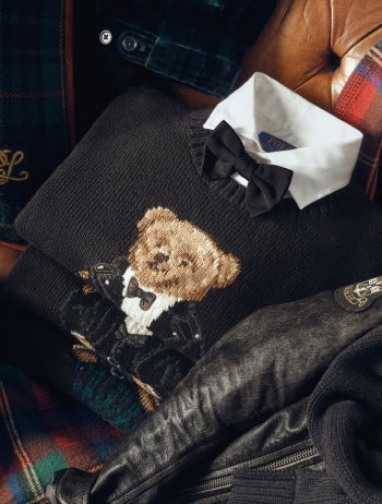 Navy sweater with Polo Bear knit at front.